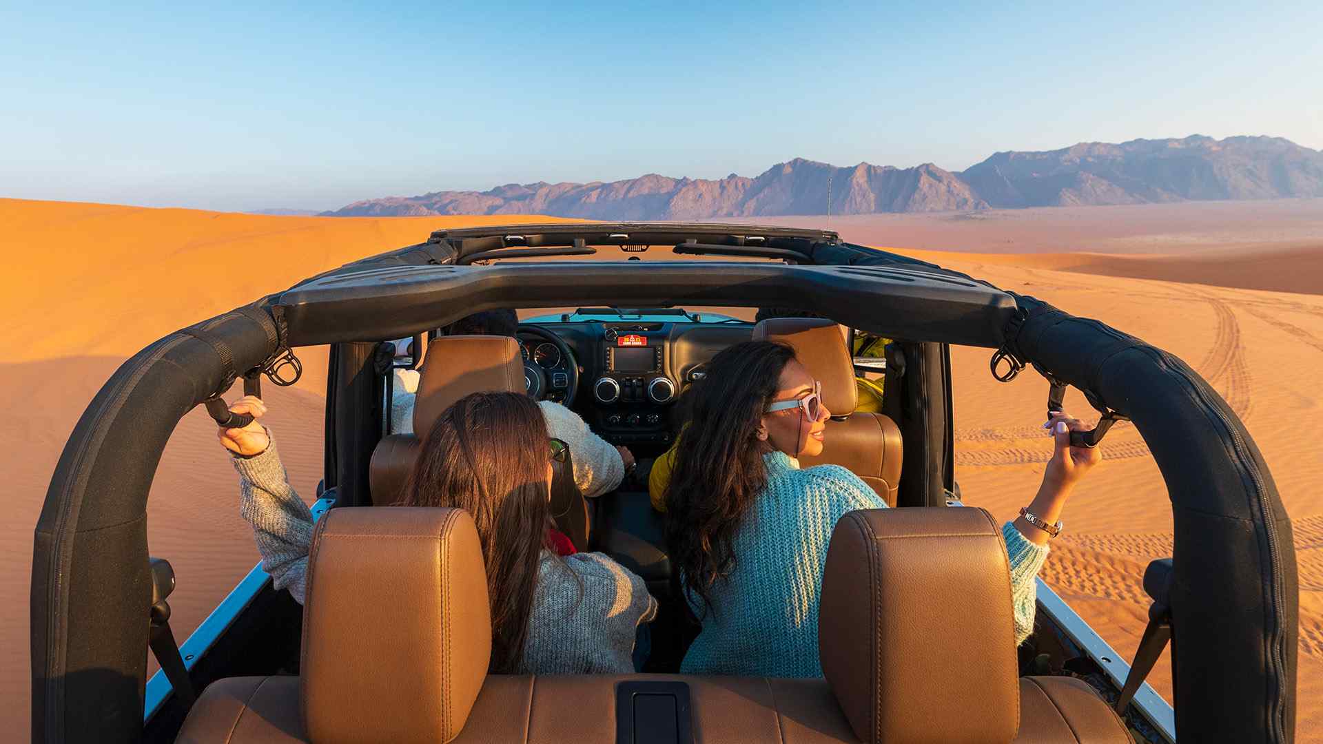 Dune bashing is like a rollercoaster on sand—fast, bumpy, and oh-so-exciting.