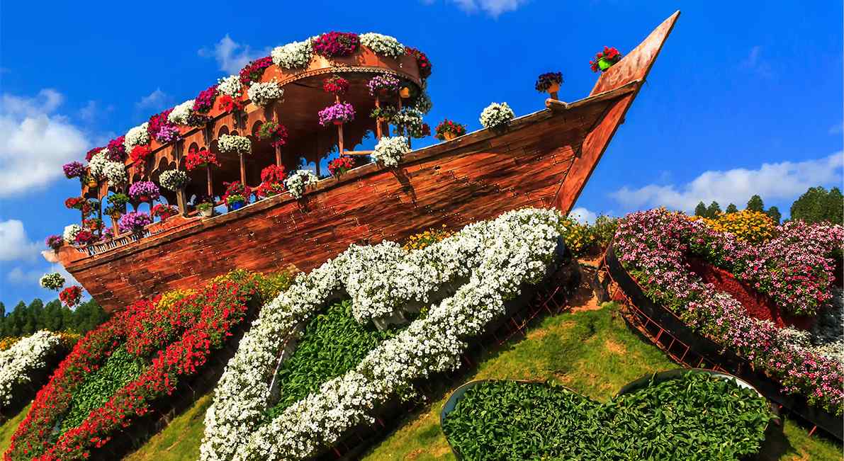 Explore the vertical beauty of Dubai Miracle Garden through a captivating passage leading to a lower section.