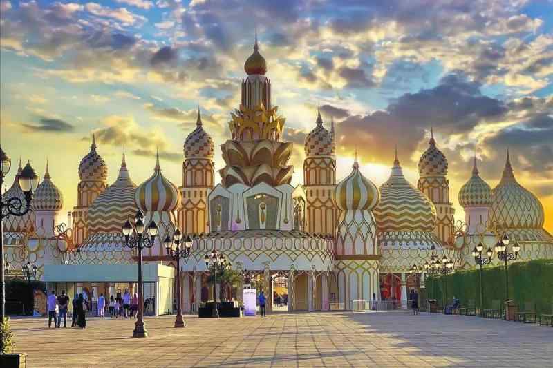 Global Village, Dubai's top evening destination, blends festivals and theme parks, offering a virtual world tour with replica architecture, cultural zones, food pavilions, shows, rides, and markets.